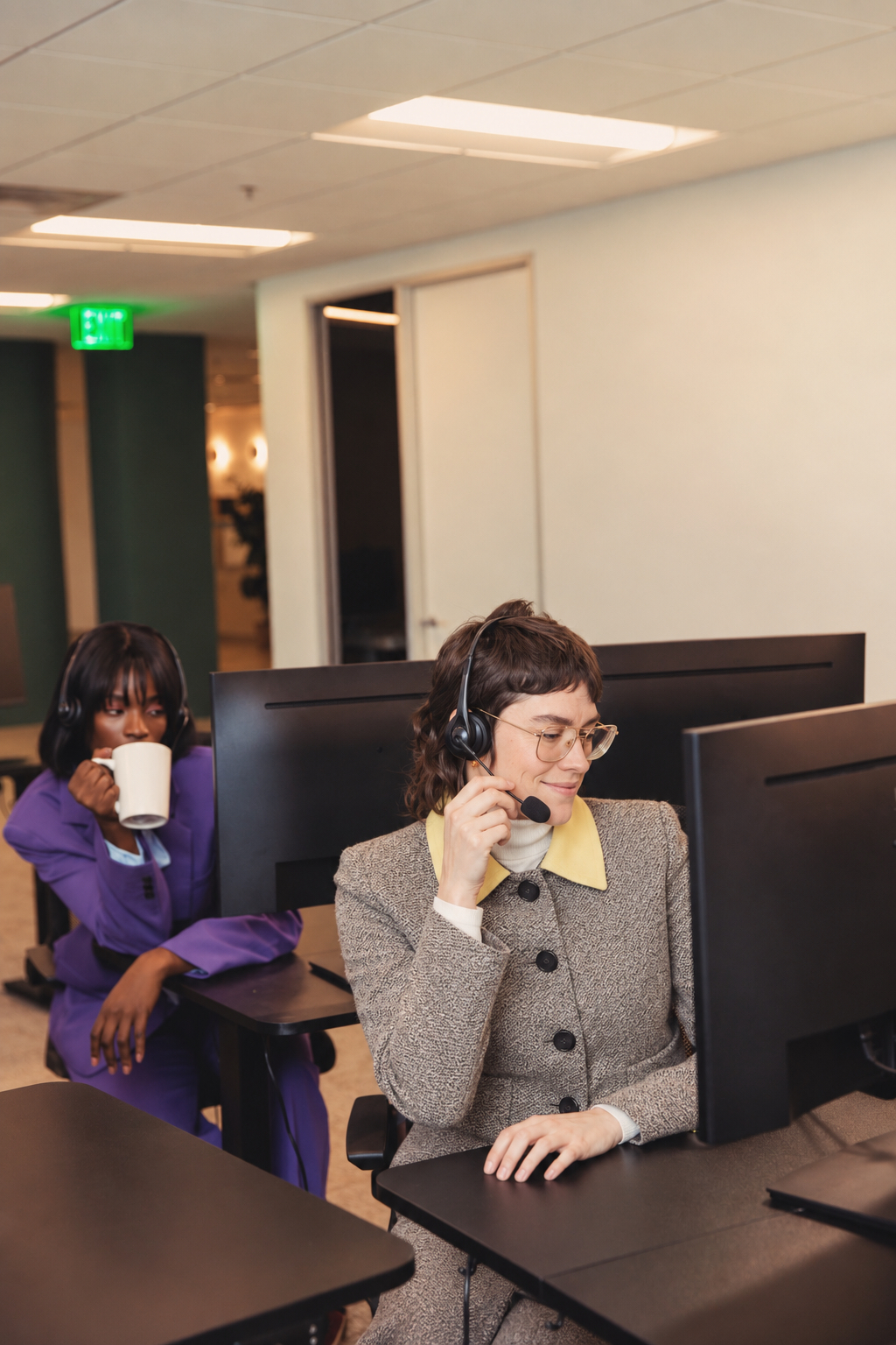 Support agent beside an office workstation