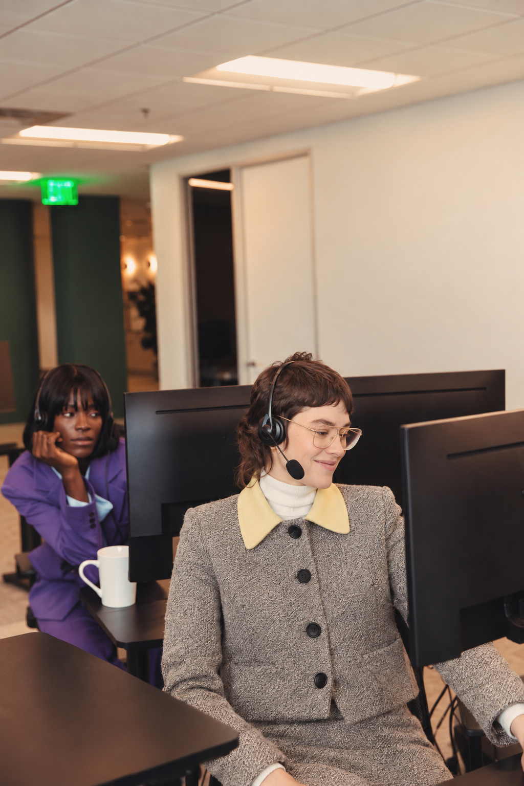 Support agent at a desk with a telephone